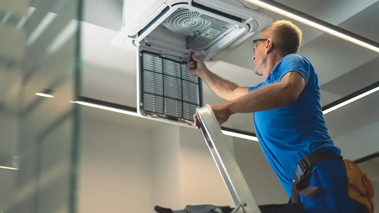 Installation technician installing new vent register | HVAC Installation | Fairhope HVAC repair
